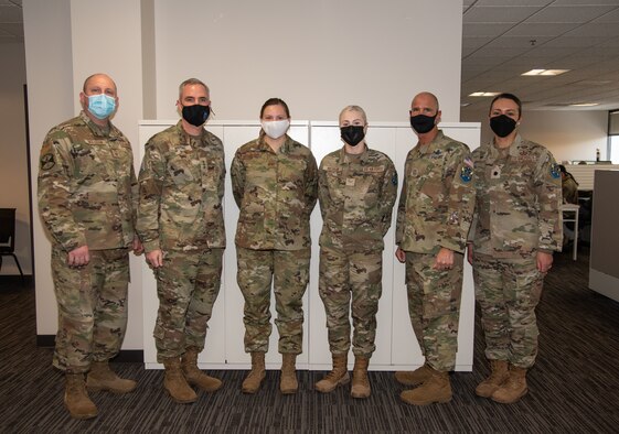 Airmen stand together for a group photo