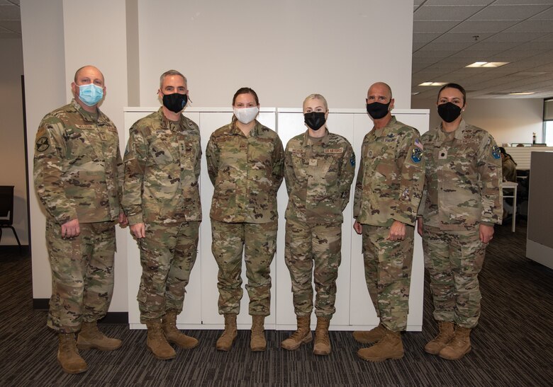 Airmen stand together for a group photo