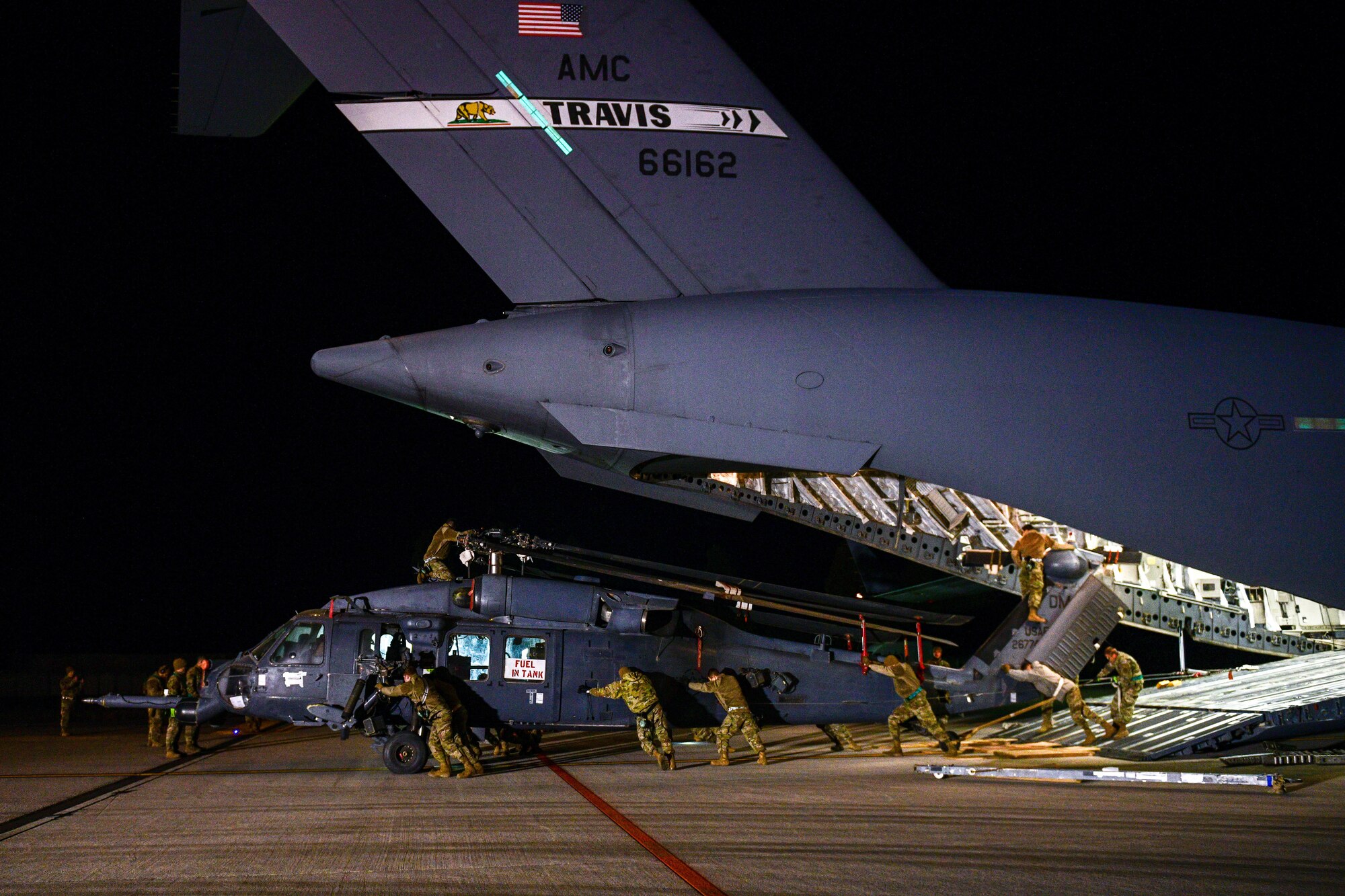 U.S. Air Force Airmen assigned to the 724th Air Mobility Squadron unload an HH-60G Pave Hawk that was deployed with the 56th Rescue Squadron, at Aviano Air Base, Italy, Feb. 9, 2022. The HH-60G is tasked to perform military operations other than war, including civil search and rescue, medical evacuation, disaster response, humanitarian assistance, security cooperation/aviation advisory, NASA space flight support, and rescue command and control. (U.S. Air Force photo by Senior Airman Brooke Moeder)