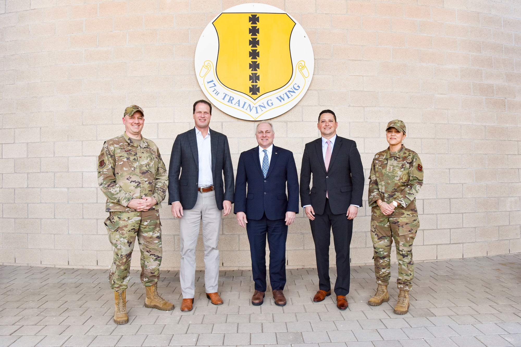 U.S. Col. Matthew Reilman, 17th Training Wing commander, U.S. Representative August Pfluger, House Minority Whip Steve Scalise, U.S. Representative Tony Gonzales and Chief Master Sgt. Rebecca Arbona, 17th Training Wing command chief, pose for a picture outside of the Norma Brown Building at Goodfellow Air Force Base, Texas.