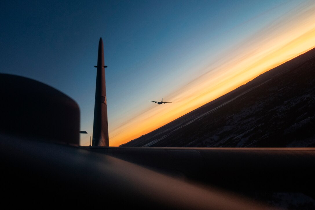 A photo taken from one aircraft shows a second aircraft on the horizon.