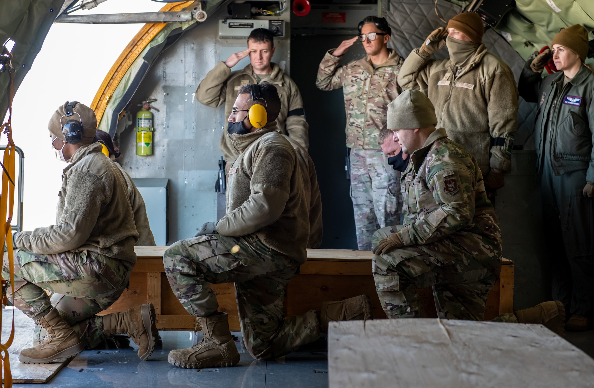 Airmen prepare to lift an empty casket box during a cargo loading exercise Feb. 5, 2022 at Hill Air Force Base, Utah