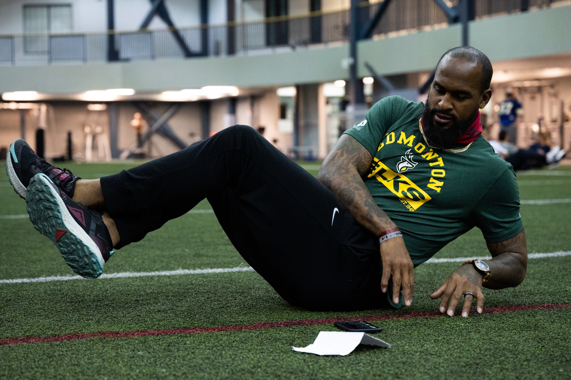 Former National Football League (NFL) player Emmanuel Arceneaux leads a workout during Pro Blitz Alaska on Eielson Air Force Base, Alaska, Feb. 11, 2022.