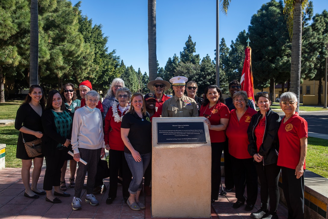 U.S. Marine Corps Brig. Gen. Jason L. Morris, commanding general of Marine Corps Recruit Depot San Diego and the Western Recruiting Region, and members of the Women Marines Association take a group photo at Marine Corps Recruit Depot San Diego, Feb. 11, 2022. The battalion was established on February 13, 1943 as part of the Marine Corps Reserves to provide qualified women for duty at shore establishments across the Marine Corps.