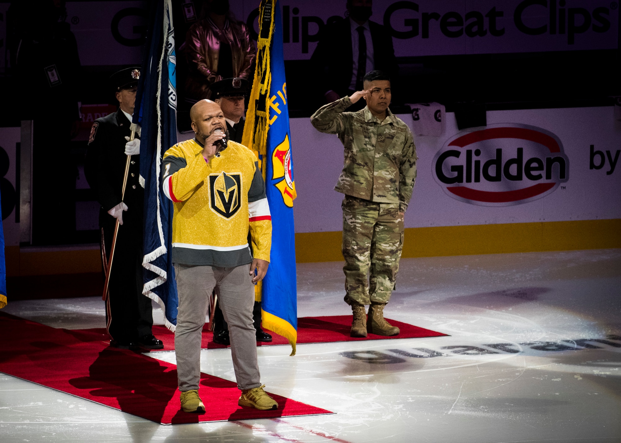 Senior Airman Fernando Cruz, 926th Wing reservist, renders a salute during the National Anthem at the National Hockey League All Stars game, Feb. 4, 2022, at T-Mobile Arena in Las Vegas, Nev. The NHL All Stars game was hosted in Las Vegas and hosts some of the most talented players in a friendly exhibition game. 
