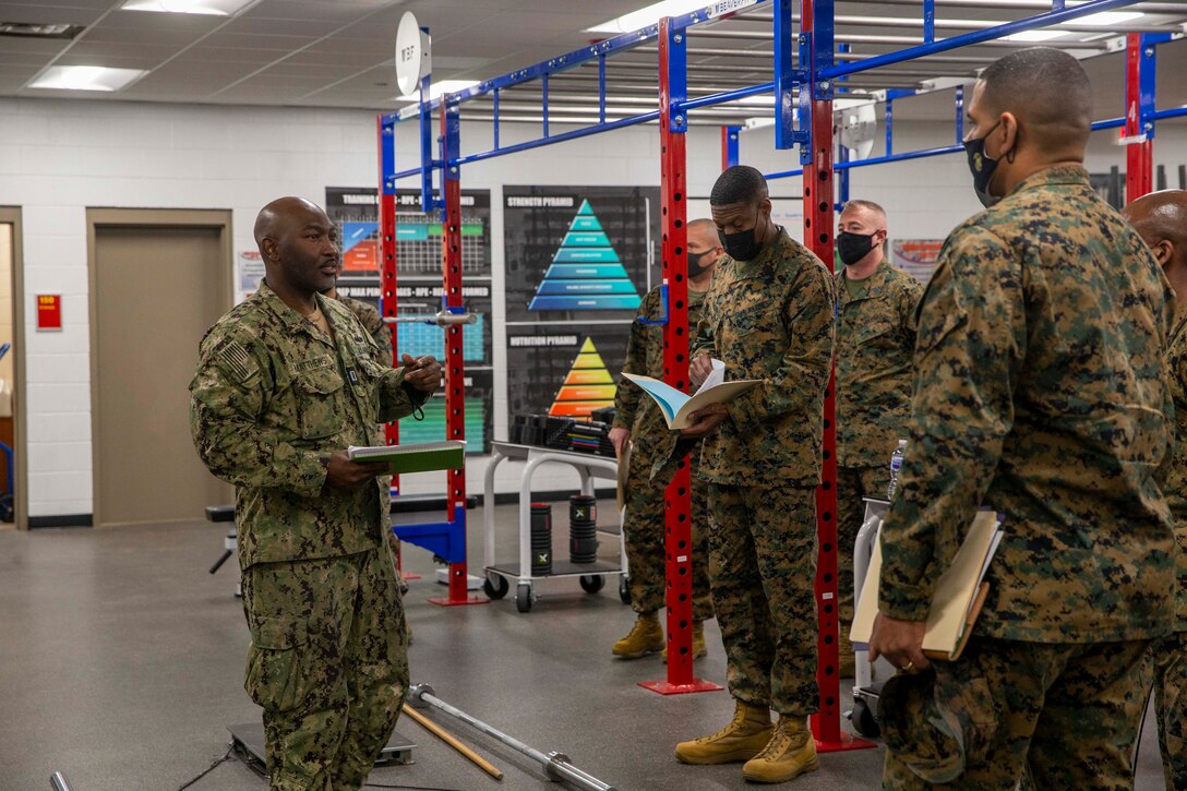 U.S. Navy Lt. Kenneth Matthews discusses entry-level mental fitness with force level sergeants major during a human performance brief at School of Infantry-East, Camp Lejeune, North Carolina, Jan. 11, 2022. The brief was part of a three-day Sergeant Major of the Marine Corps Force Level Summit. The summits are held quarterly to support force level sergeants major at their respective commands. (U.S. Marine Corps photo by Sgt. Victoria Ross)