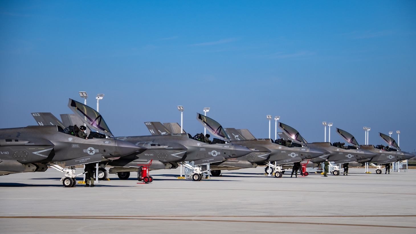 F-35C Lightning IIs, assigned to the "Argonauts" of Strike Fighter Squadron (VFA) 147, taxi on the flight line.