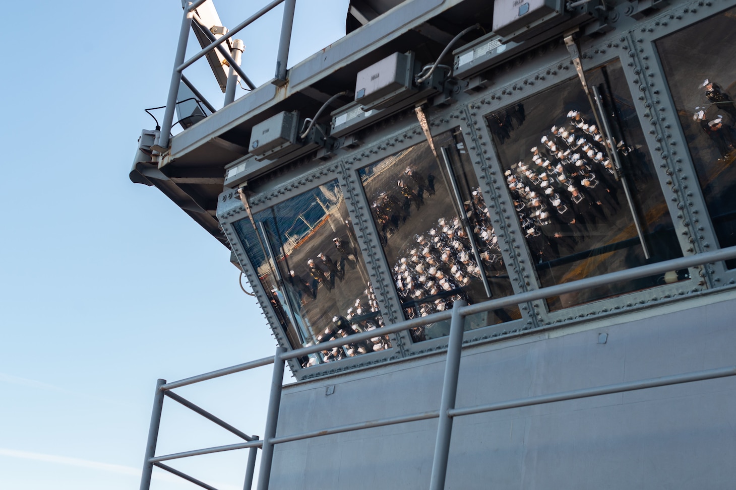 Sailors man the rails aboard the Nimitz-class aircraft carrier USS Carl Vinson (CVN 70).