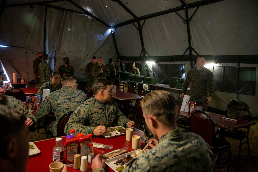 U.S. Marine Corps Sgt. Maj. Troy E. Black, the 19th Sergeant Major of the Marine Corps, speaks to Marines during a tour of Camp Upshur at Marine Corps Base Quantico, Virginia, Dec. 7, 2021. The purpose of the visit was to tour the facilities at Camp Upshur, meet with service members supporting the Task Force, and discuss future plans for Operation Allies Welcome. The Department of Defense, through U.S. Northern Command, and in support of the Department of Homeland Security, is providing transportation, temporary housing, medical screening, and general support for at least 50,000 Afghan evacuees at suitable facilities, in permanent or temporary structures, as quickly as possible. This initiative provides Afghan personnel essential support at secure locations outside Afghanistan. (U.S. Marine Corps photo by Sgt. Victoria Ross)