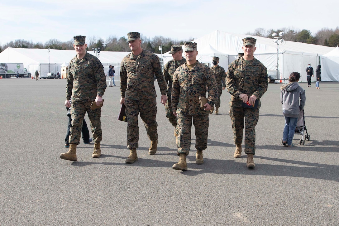 U.S. Marine Corps Sgt. Maj. Troy E. Black, the 19th Sergeant Major of the Marine Corps, tours Camp Upshur at Marine Corps Base Quantico, Virginia, Dec. 7, 2021. The purpose of the visit was to tour the facilities at Camp Upshur, meet with service members supporting the Task Force, and discuss future plans for Operation Allies Welcome. The Department of Defense, through U.S. Northern Command, and in support of the Department of Homeland Security, is providing transportation, temporary housing, medical screening, and general support for at least 50,000 Afghan evacuees at suitable facilities, in permanent or temporary structures, as quickly as possible. This initiative provides Afghan personnel essential support at secure locations outside Afghanistan. (U.S. Marine Corps photo by Sgt. Victoria Ross)