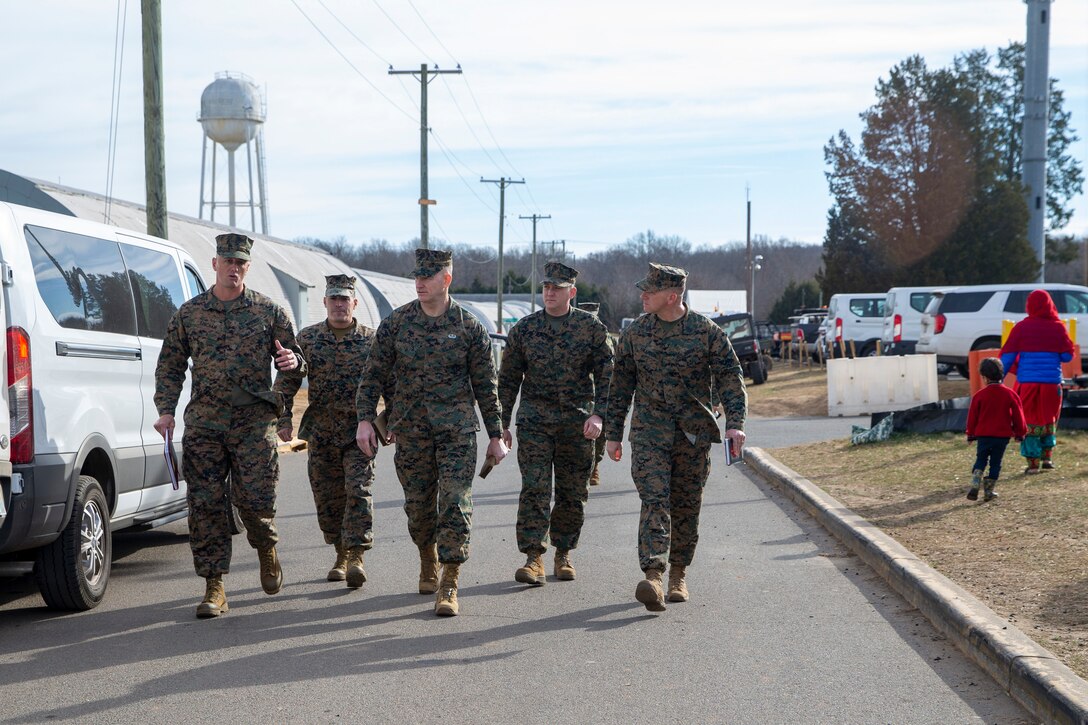 U.S. Marine Corps Sgt. Maj. Troy E. Black, the 19th Sergeant Major of the Marine Corps, tours Camp Upshur at Marine Corps Base Quantico, Virginia, Dec. 7, 2021. The purpose of the visit was to tour the facilities at Camp Upshur, meet with service members supporting the Task Force, and discuss future plans for Operation Allies Welcome. The Department of Defense, through U.S. Northern Command, and in support of the Department of Homeland Security, is providing transportation, temporary housing, medical screening, and general support for at least 50,000 Afghan evacuees at suitable facilities, in permanent or temporary structures, as quickly as possible. This initiative provides Afghan personnel essential support at secure locations outside Afghanistan. (U.S. Marine Corps photo by Sgt. Victoria Ross)