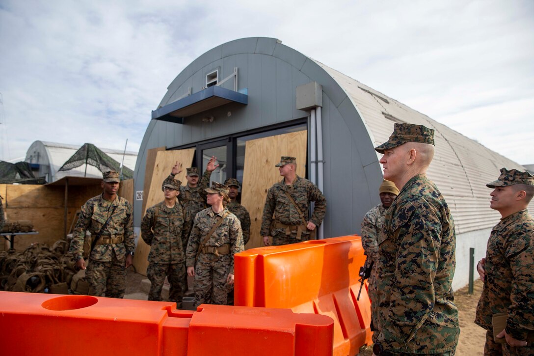 U.S. Marine Corps Sgt. Maj. Troy E. Black, the 19th Sergeant Major of the Marine Corps, speaks to Marines about the importance of Operation Allies Welcome while visiting Camp Upshur at Marine Corp Base Quantico, Virginia, Dec. 7, 2021. The purpose of the visit was to tour the facilities at Camp Upshur, meet with service members supporting the Task Force, and discuss future plans for Operation Allies Welcome. The Department of Defense, through U.S. Northern Command, and in support of the Department of Homeland Security, is providing transportation, temporary housing, medical screening, and general support for at least 50,000 Afghan evacuees at suitable facilities, in permanent or temporary structures, as quickly as possible. This initiative provides Afghan personnel essential support at secure locations outside Afghanistan. (U.S. Marine Corps photo by Sgt. Victoria Ross)