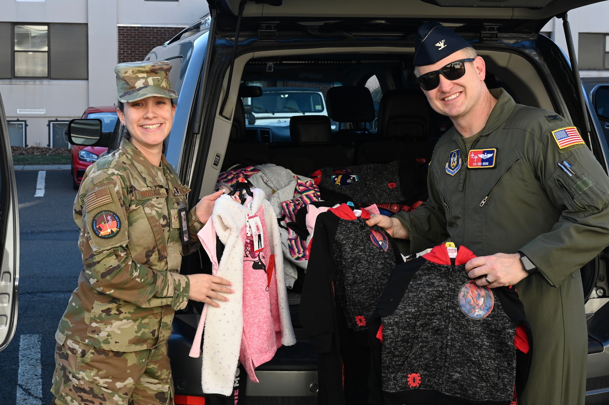 Members with Task Force Liberty and the 514th Air Mobility Wing receive and process a donation of coats that will go towards the Afghan guests currently at Liberty Village on Joint Base McGuire-Dix-Lakehurst, New Jersey, February 11, 2022. The Department of Defense, through U.S. Northern Command, and in support of the Department of Homeland Security, is providing transportation, temporary housing, medical screening, and general support for at least 50,000 Afghan evacuees at suitable facilities, in permanent or temporary structures, as quickly as possible. This initiative provides Afghan personnel essential support at secure locations outside Afghanistan. (U.S. Air Force photo by Airman 1st Class Darius Frazier.)