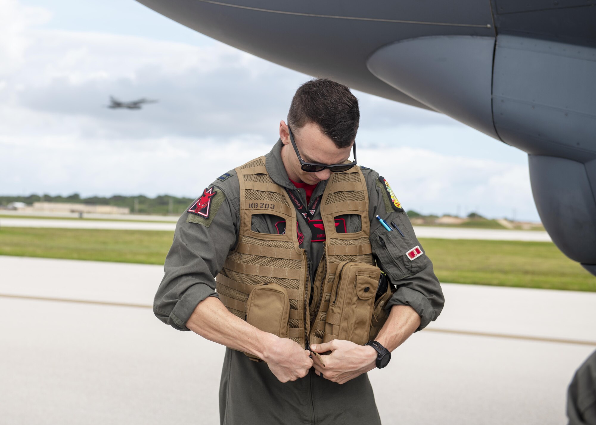 U.S. Air Force Capt. Chris Evelyn, 96th Expeditionary Bomb Squadron pilot, prepares to depart the flight line after arriving to Andersen Air Force Base, Guam, for a Bomber Task Force deployment, Feb. 11, 2022. The United States maintains a strong, credible bomber force that enhances the security and stability of allies and partners. BTF missions demonstrate lethality and interoperability in support of a free and open Indo-Pacific.  (U.S. Air Force photo by Staff Sgt. Lawrence Sena)