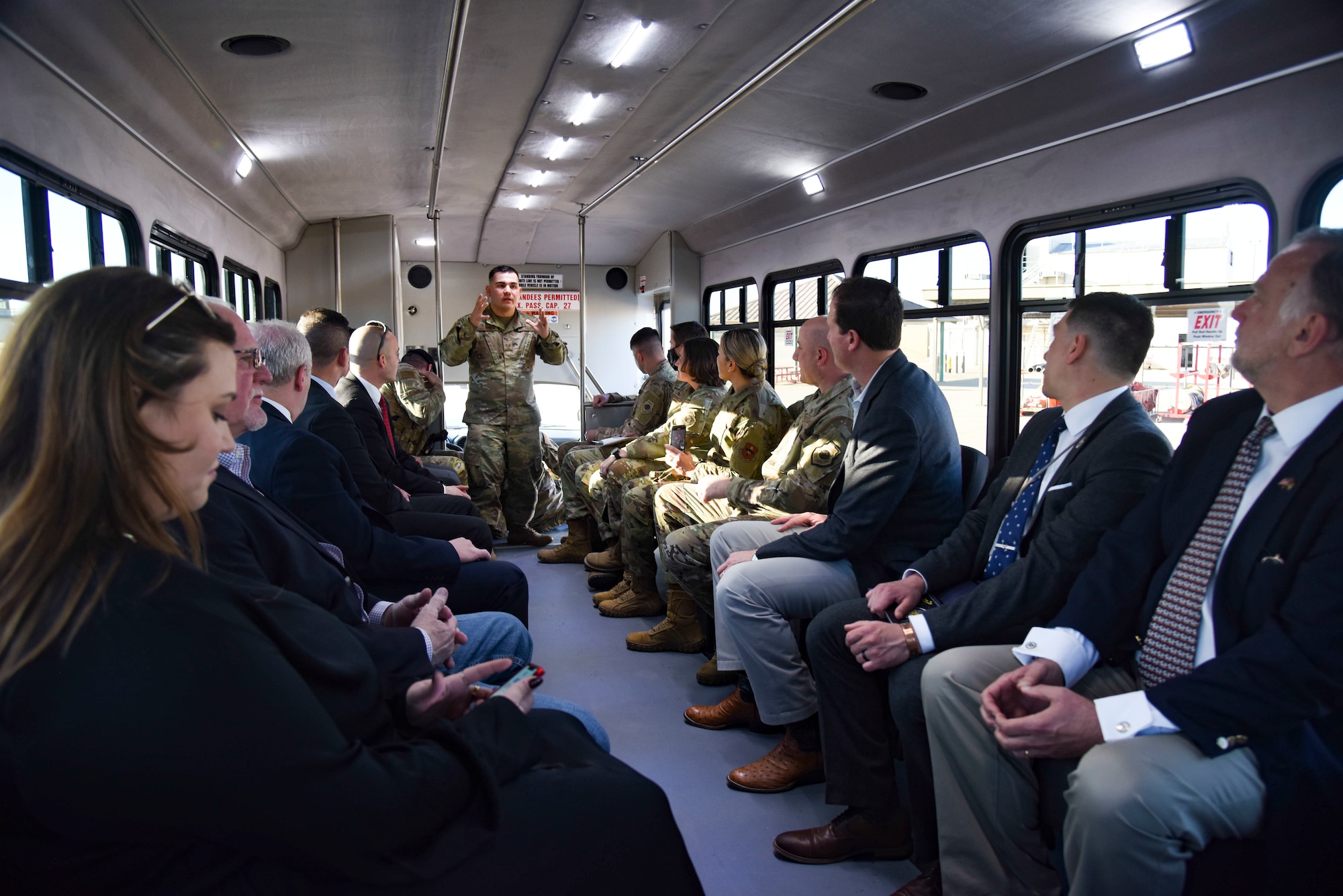 U.S. Air Force Staff Sgt. Joshua Leonida, 312th Training Squadron instructor, briefs Col. Matthew Reilman, 17th Training Wing commander, House Minority Whip Steve Scalise, U.S. Representatives August Pfluger and Tony Gonzales, along with 17th TRW leaders during a tour of the Louis F. Garland Department of Defense Fire Academy training grounds aboard a bus at Goodfellow Air Force Base, Texas.