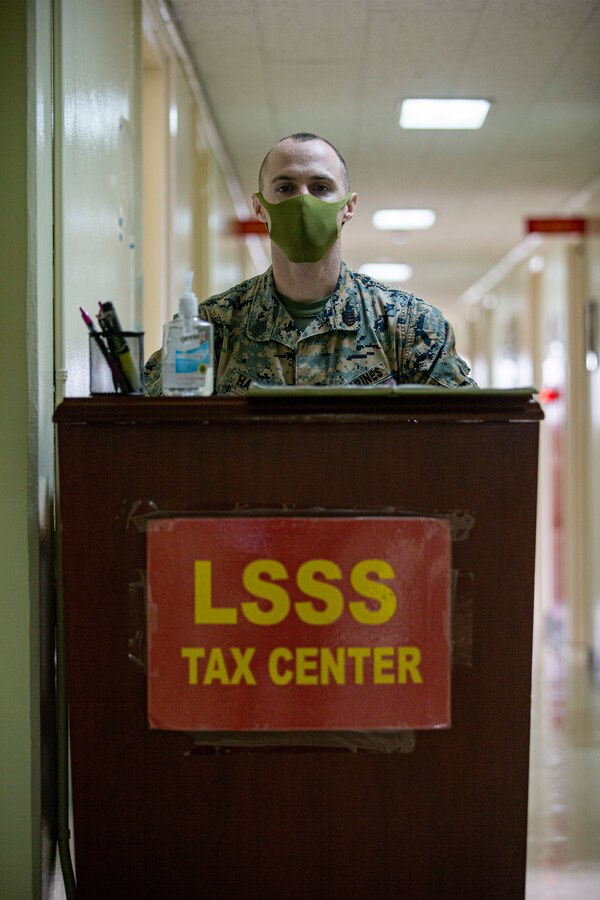 U.S. Marine Corps Staff Sgt. Michael Hammack, staff noncommissioned officer in charge with the Camp Foster Tax Center, Headquarters and Support Battalion, Marine Corps Installations Pacific, awaits customers at the Camp Foster Tax Center on Camp Foster, Okinawa, Japan, Feb. 10, 2022. The Camp Foster Tax Center assists eligible taxpayers with the preparation of e-filing both federal income tax returns and state income tax returns, as applicable. The team at the Tax Center not only assists service members of any branch, but also any eligible taxpayer that has base access, including but not limited to retired service members aboard Okinawa, dependents, and status of forces agreement personnel. (U.S. Marine Corps photo by Lance Cpl. Alex Fairchild)