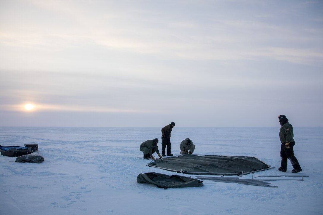 (File photo) Airmen with the 109th Airlift Wing’s Skiway construction team employ barren land survival techniques as they erect the first shelter at Camp Rockwell during Air National Guard Exercise Arctic Eagle. (U.S. Air National Guard photo by Technical Sergeant Jamie Spaulding/released)