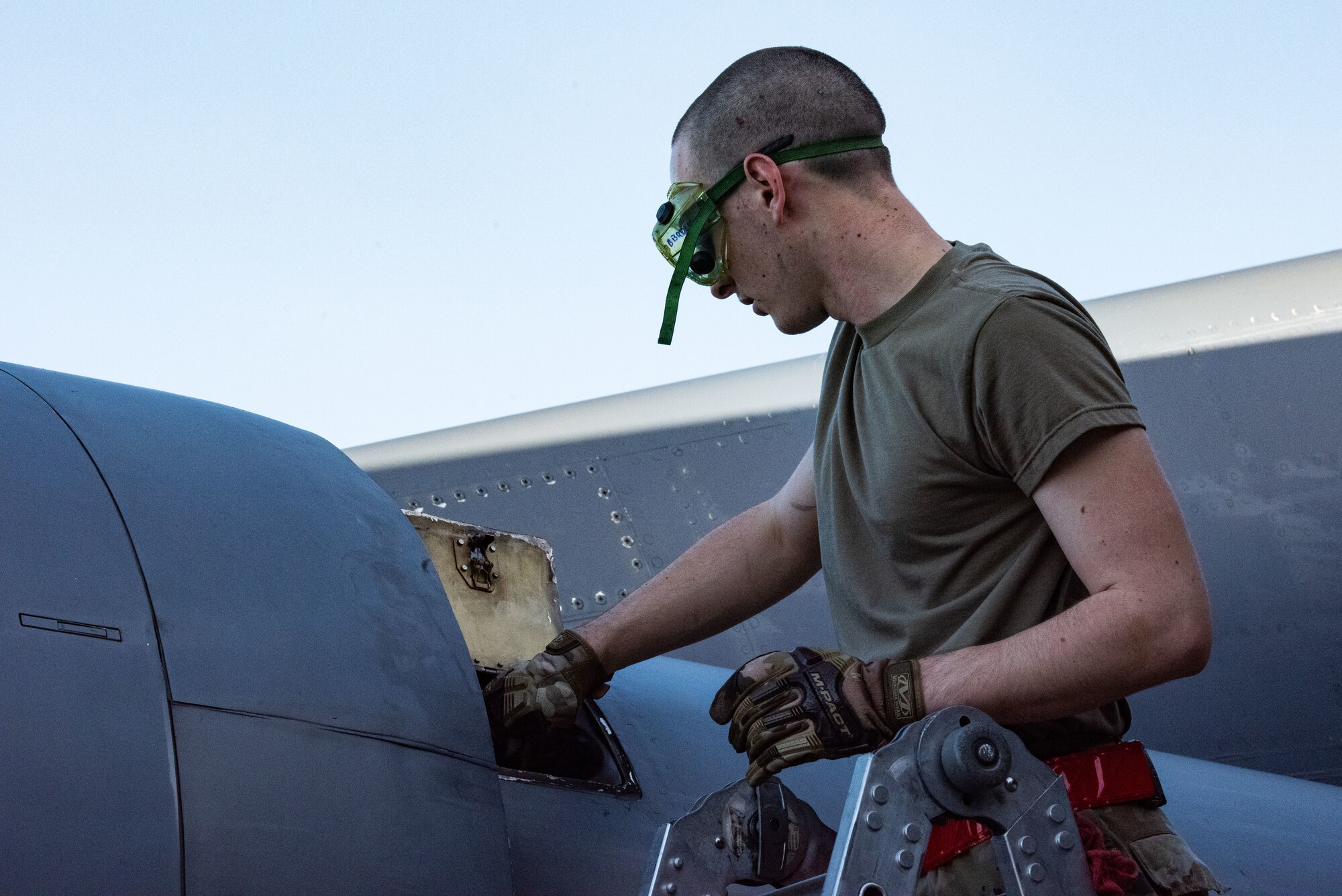Airman 1st Class Camron Young, 2nd Aircraft Maintenance Squadron crew chief, conducts post-flight maintenance on a B-52 Stratofortress in support of a Bomber Task Force mission at Andersen Air Force Base, Guam, Feb. 9th, 2022. BTF missions demonstrate lethality and interoperability in support of a free and open Indo-Pacific. (U.S. Air Force photo by Senior Airman Jonathan E. Ramos)