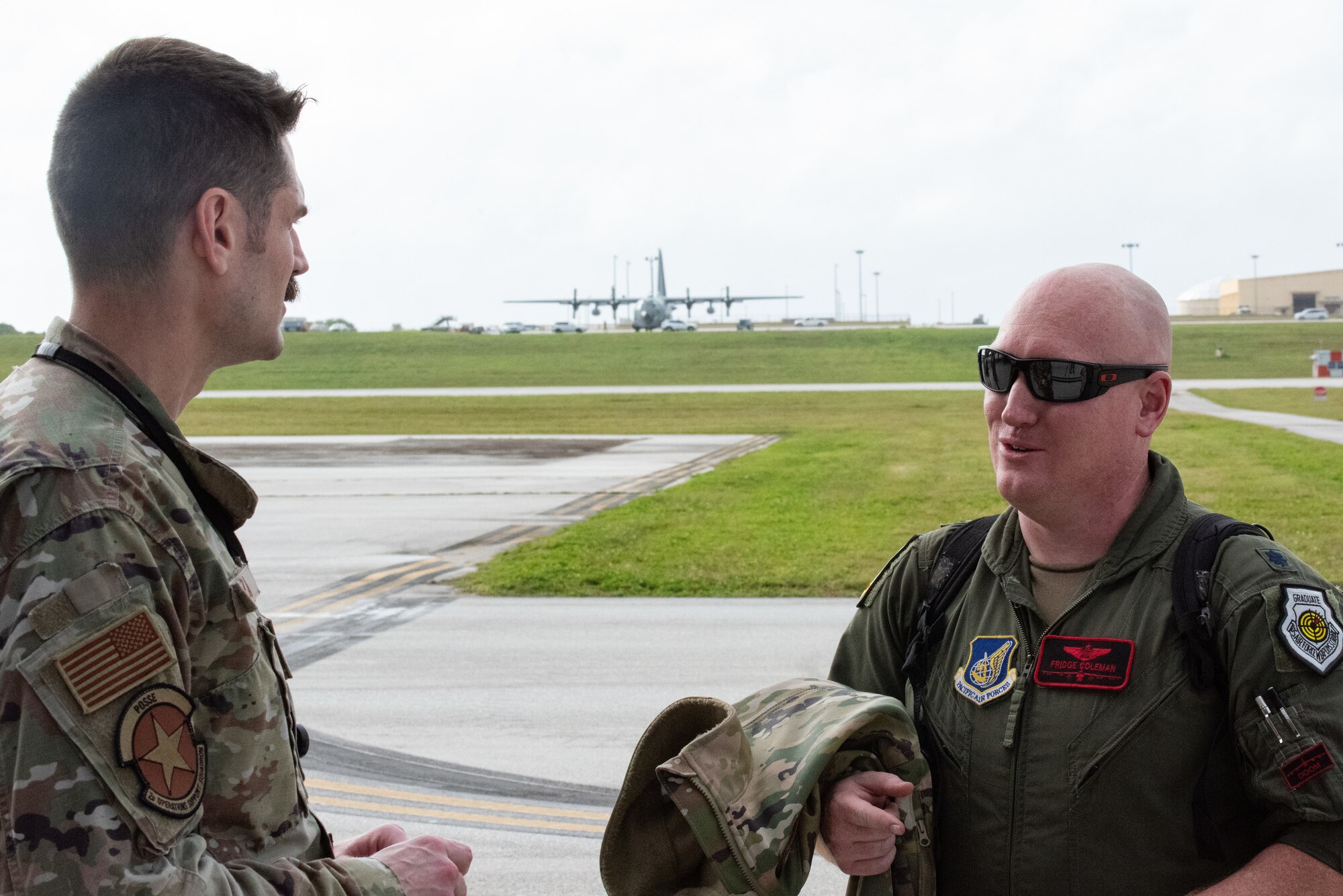 Lt. Col. Christopher Coleman, 96th Expeditionary Bomb Squadron commander, is greeted by Maj. Kris Souza, 96th EBS director of operations, during a Bomber Task Force deployment at Andersen Air Force Base, Guam, Feb. 9th, 2022. BTF deployments enhance readiness to respond to any potential crisis or challenge in the Indo-Pacific. (U.S. Air Force photo by Senior Airman Jonathan E. Ramos)
