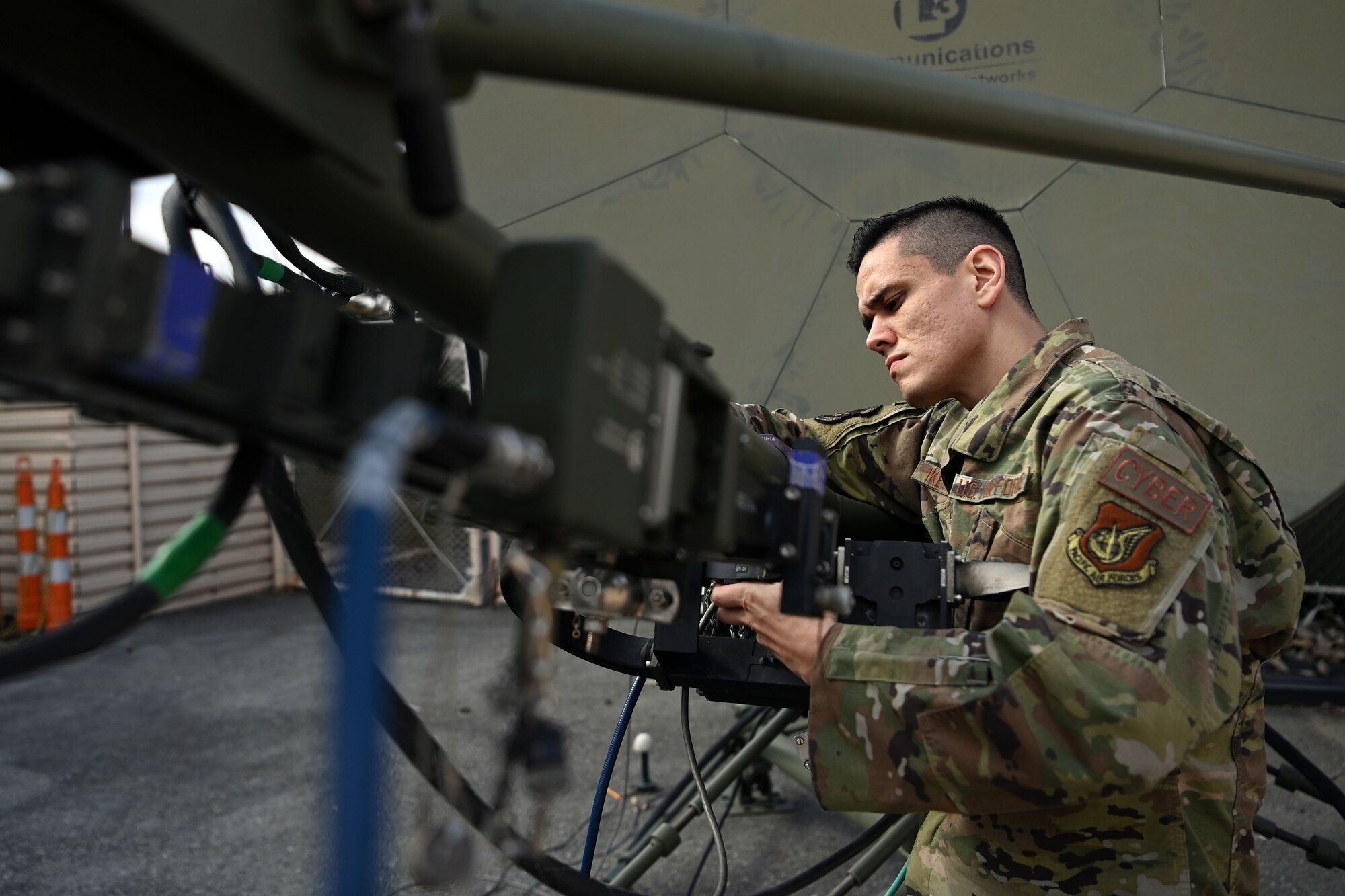 Tech. Sgt. Kazuhito Ikematsu, 607th Material Maintenance Squadron, works on a ground multiband terminal at Contingency Operating Base Gwangju Air Base, Republic of Korea (ROK), February 15, 2022. This is his second assignment to the ROK and he hopes to one day retire here. (U.S. Air Force Master Sgt. Rachelle Morris)