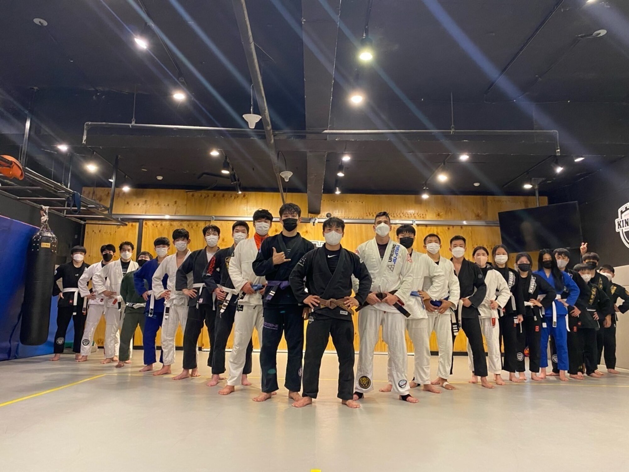 Tech. Sgt. Kazuhito Ikematsu, 607th Material Maintenance Squadron, right of center, poses for a photo with his gym mates in Gwangju, Republic of Korea (ROK), in December, 2021. He hopes to open his own gym in the ROK one day. (Courtesy photo)