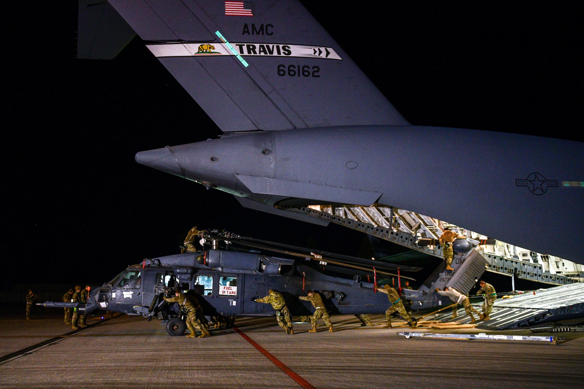 U.S. Air Force Airmen assigned to the 724th Air Mobility Squadron unload an HH-60G Pave Hawk that was deployed with the 56th Rescue Squadron, at Aviano Air Base, Italy, Feb. 9, 2022. The HH-60G is tasked to perform military operations other than war, including civil search and rescue, medical evacuation, disaster response, humanitarian assistance, security cooperation/aviation advisory, NASA space flight support, and rescue command and control. (U.S. Air Force photo by Senior Airman Brooke Moeder)
