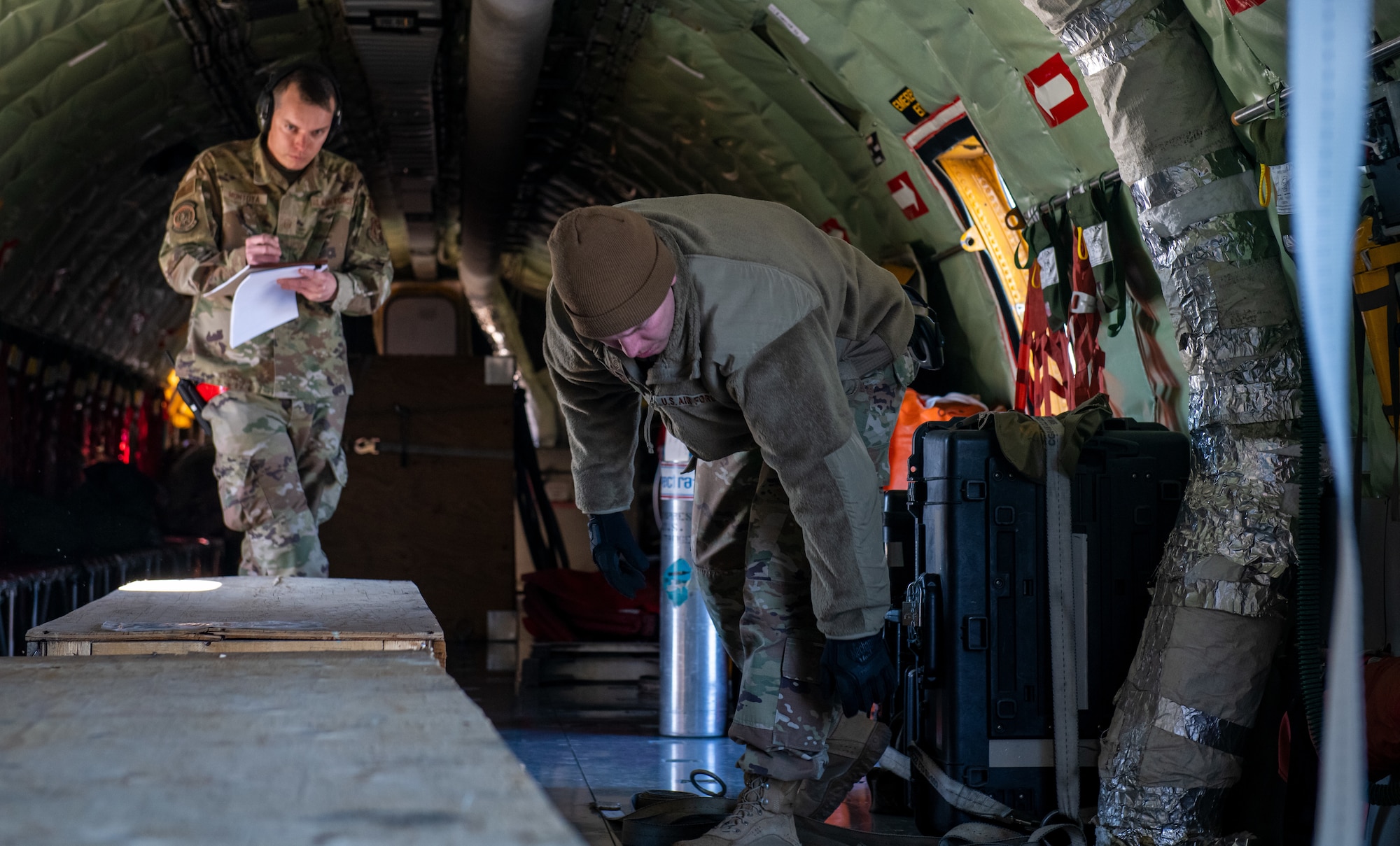 U.S. Air Force Master Sgt. Chris Montoya, ramp training manager with the 67th Aerial Port Squadron, jots down notes as he oversees a cargo training exercise Feb. 5, 2022 at Hill Air Force Base, Utah