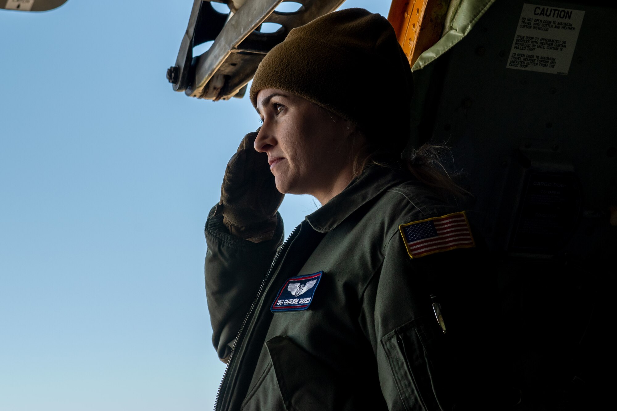 U.S. Air Force Tech. Sgt. Catherine Roberts, boom operator with the 336th Air Refueling Squadron from March Air Reserve Base, California, salutes an empty casket during a cargo loading exercise Feb. 5, 2022 at Hill Air Force Base, Utah