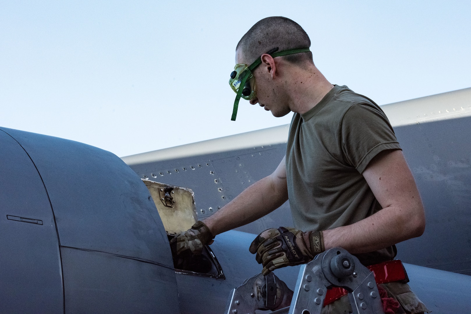 Airman 1st Class Camron Young, 2nd Aircraft Maintenance Squadron crew chief, conducts post-flight maintenance on a B-52 Stratofortress in support of a Bomber Task Force mission at Andersen Air Force Base, Guam, Feb. 9th, 2022. BTF missions demonstrate lethality and interoperability in support of a free and open Indo-Pacific. (U.S. Air Force photo by Senior Airman Jonathan E. Ramos)