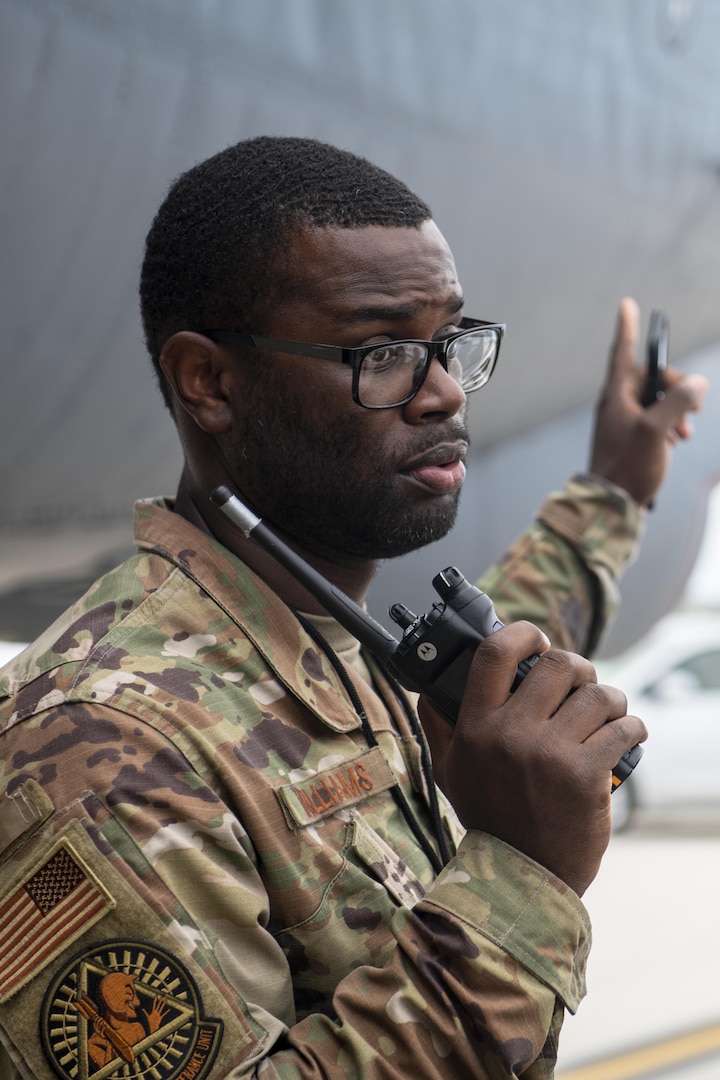 U.S. Air Force Master Sgt. Anthony Williams, 96th Expeditionary Bomb Squadron crew chief, directs Airmen after the arrival of B-52 Stratofortess aircraft for a Bomber Task Force deployment at Andersen Air Force Base, Guam, Feb. 11, 2022. Bomber missions familiarize aircrew with air bases and operations indifferent Geographic Combatant Commands areas of operations. (U.S. Air Force photo by Staff Sgt. Lawrence Sena)