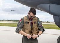 U.S. Air Force Capt. Chris Evelyn, 96th Expeditionary Bomb Squadron pilot, prepares to depart the flight line after arriving to Andersen Air Force Base, Guam, for a Bomber Task Force deployment, Feb. 11, 2022. The United States maintains a strong, credible bomber force that enhances the security and stability of allies and partners. BTF missions demonstrate lethality and interoperability in support of a free and open Indo-Pacific.  (U.S. Air Force photo by Staff Sgt. Lawrence Sena)