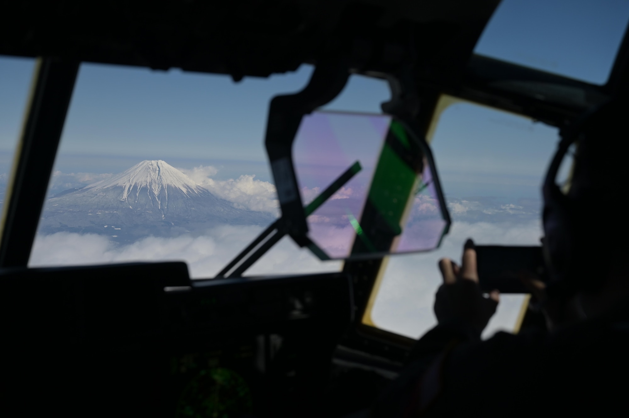 A pilot, assigned to the 36th Airlift Squadron, snaps a photo of Mt. Fuji while supporting exercise Tomodachi Rescue 22, Feb. 11, 2022.