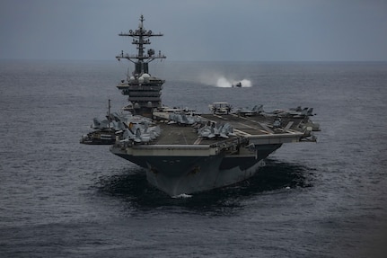 PHILIPPINE SEA (Feb. 7, 2022) The Nimitz-class aircraft carrier USS Abraham Lincoln (CVN 72) sails in formation during exercise Noble Fusion. Ships of the America and Essex Amphibious Ready Groups and the Abraham Lincoln Carrier Strike Group, alongside the Japan Maritime Self-Defense Force, participate in exercise Noble Fusion. Noble Fusion highlights that Navy and Marine Corps forward-deployed stand-in naval expeditionary forces can rapidly aggregate Marine Expeditionary Unit/Amphibious Ready Group teams at sea, along with a carrier strike group, as well as other joint force movement, and create advantage for U.S., partner and allied forces. Naval Expeditionary forces conduct training throughout the year, in the Indo-Pacific, to maintain readiness. (U.S. Navy photo by Mass Communication Specialist 3rd Class Thaddeus Berry)