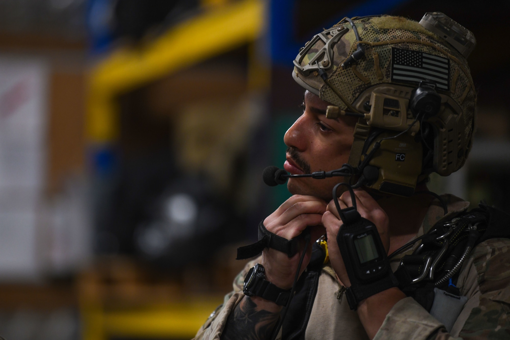 A U.S. Air Force pararescueman assigned to the 82nd Expeditionary Rescue Squadron, adjusts his helmet strap prior to jump training at Camp Lemonnier, Djibouti, Feb. 15, 2021. The 82nd ERQS maintains jump proficiency to provide secure, reliable, flexible combat search, rescue, and recovery capabilities in support of U.S. Africa Command in North and East Africa. (U.S. Air Force photo by Senior Airman Ericka A. Woolever)