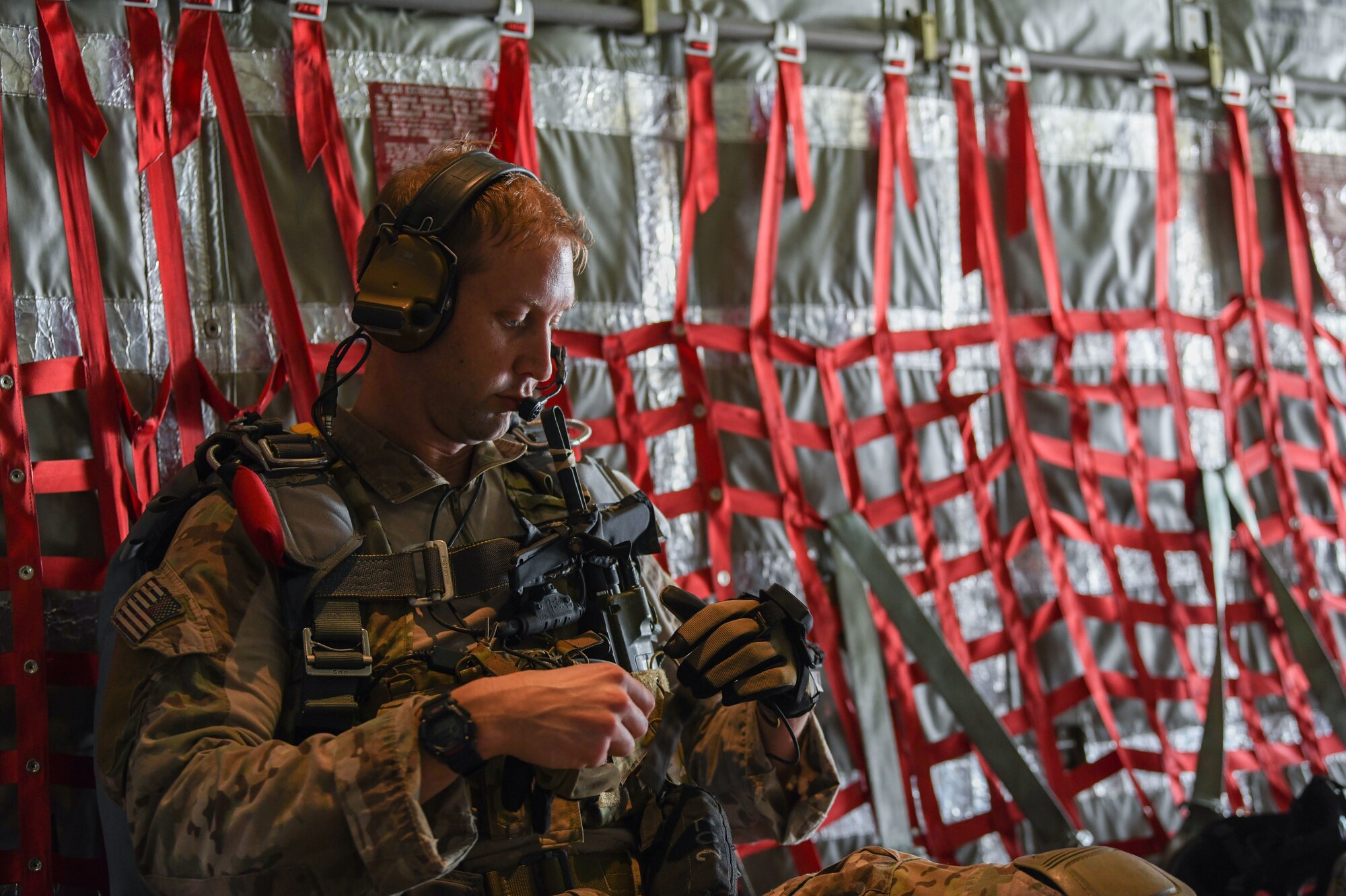 U.S. Air Force pararescueman assigned to the 82nd Expeditionary Rescue Squadron, prepares his equipment prior jump training from a U.S. Marine Corps KC-130J Super Hercules at Camp Lemonnier, Djibouti, Feb. 15, 2021. The 82nd ERQS maintains jump proficiency to provide secure, reliable, flexible combat search, rescue, and recovery capabilities in support of U.S. Africa Command in North and East Africa. They also serve as U.S. Air Forces Africa’s personnel recovery liaison, coordinating efforts between coalition and joint forces in East Africa and enhancing the combatant command’s Warfighter Recovery Network.  (U.S. Air Force photo by Senior Airman Ericka A. Woolever)