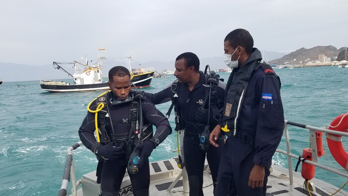 SCH Jesuino Santos conducts safety checks on 2SARG Isaias Taveres, Cabo Verde Coast Guard diver, before they enter the water to conduct diving operations in the Porto Grande, Mindelo, Sao Vicente, Jan. 28, 2022. U.S. Sixth Fleet, headquartered in Naples, Italy, conducts the full spectrum of joint and naval operations, often in concert with allied and interagency partners, in order to advance U.S. national interests and security and stability in Europe and Africa
