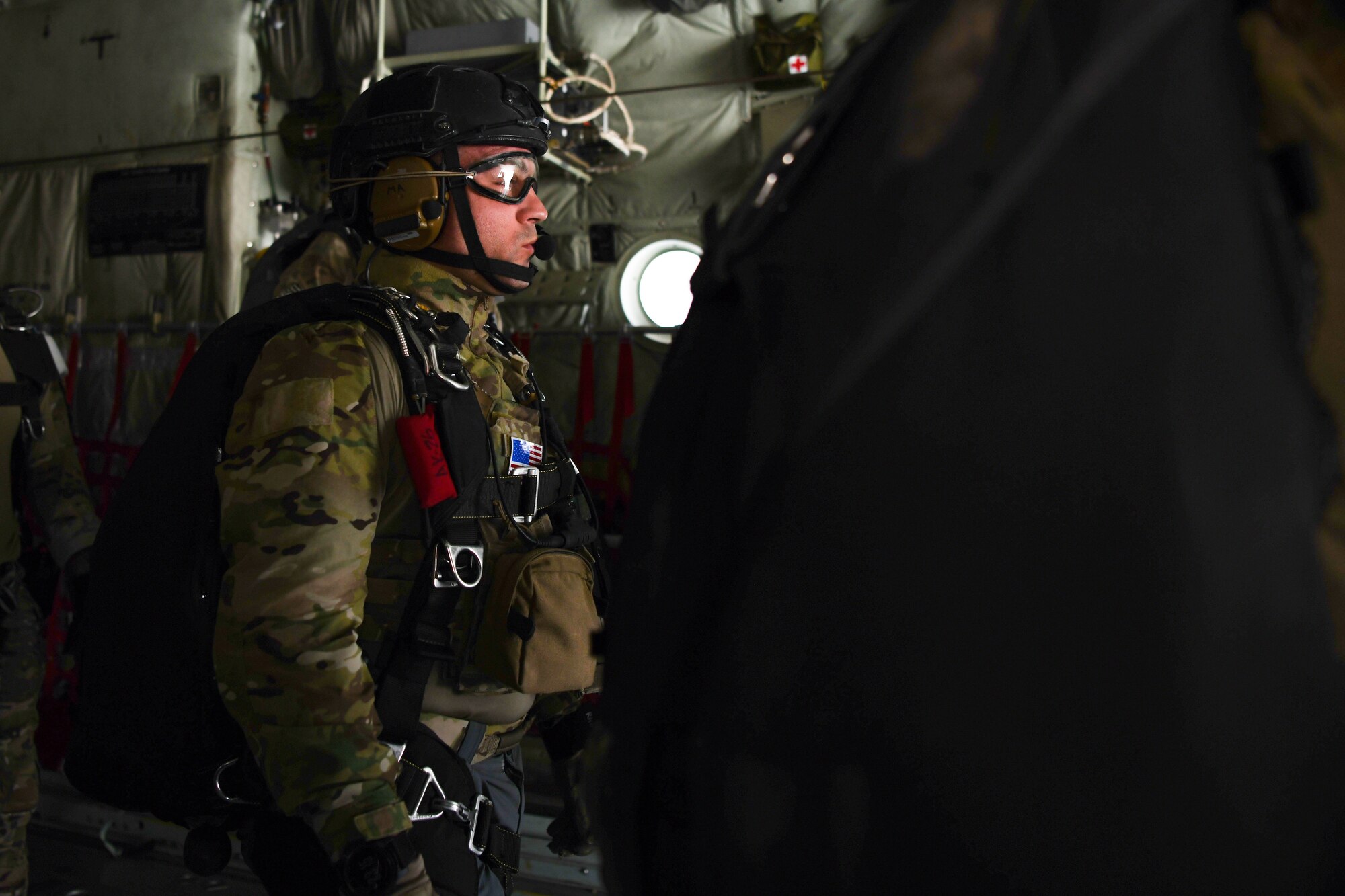 U.S. Air Force pararescuemen assigned to the 82nd Expeditionary Rescue Squadron, prepare for a training jump from a U.S. Marine Corps KC-130J Super Hercules over East Africa, Feb. 15, 2021. The 82nd ERQS maintains jump proficiency to provide secure, reliable, flexible combat search, rescue, and recovery capabilities in support of U.S. Africa Command in North and East Africa. They are qualified experts in advanced weapons and small unit tactics, airborne and military free fall, combat divers, high angle and confined space rescue operations, small boat and vehicle craft utilization, rescue swimmers, and battlefield trauma-paramedics. (U.S. Air Force photo by Senior Airman Ericka A. Woolever)