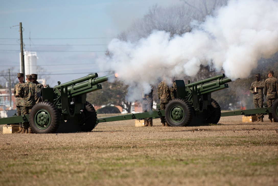 U.S. Marines with Echo Battery, 2nd Battalion, 10th Marine Regiment, 2nd Marine Division, conduct a 21-gun salute at William Pendleton Thomas Field on Marine Corps Base Camp Lejeune, North Carolina, Feb. 17, 2020