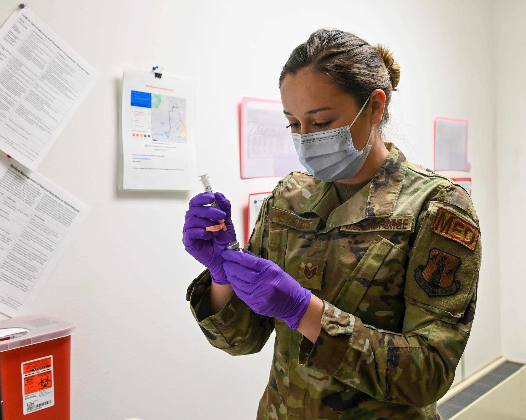 U.S. Air Force Staff Sgt. Brittany Reynolds, a medical technician assigned to the 115th Medical Group, Truax Field, Madison, Wis., prepares to administer the Moderna COVID-19 Vaccine to 115th Fighter Wing members who are slated to receive the Moderna COVID-19 Vaccine January 6, 2021. The 115th Fighter Wing has recently made the vaccine available to all members of the unit on a first come, first served basis.  (U.S. Air National Guard photo by Senior Airman Cameron Lewis)