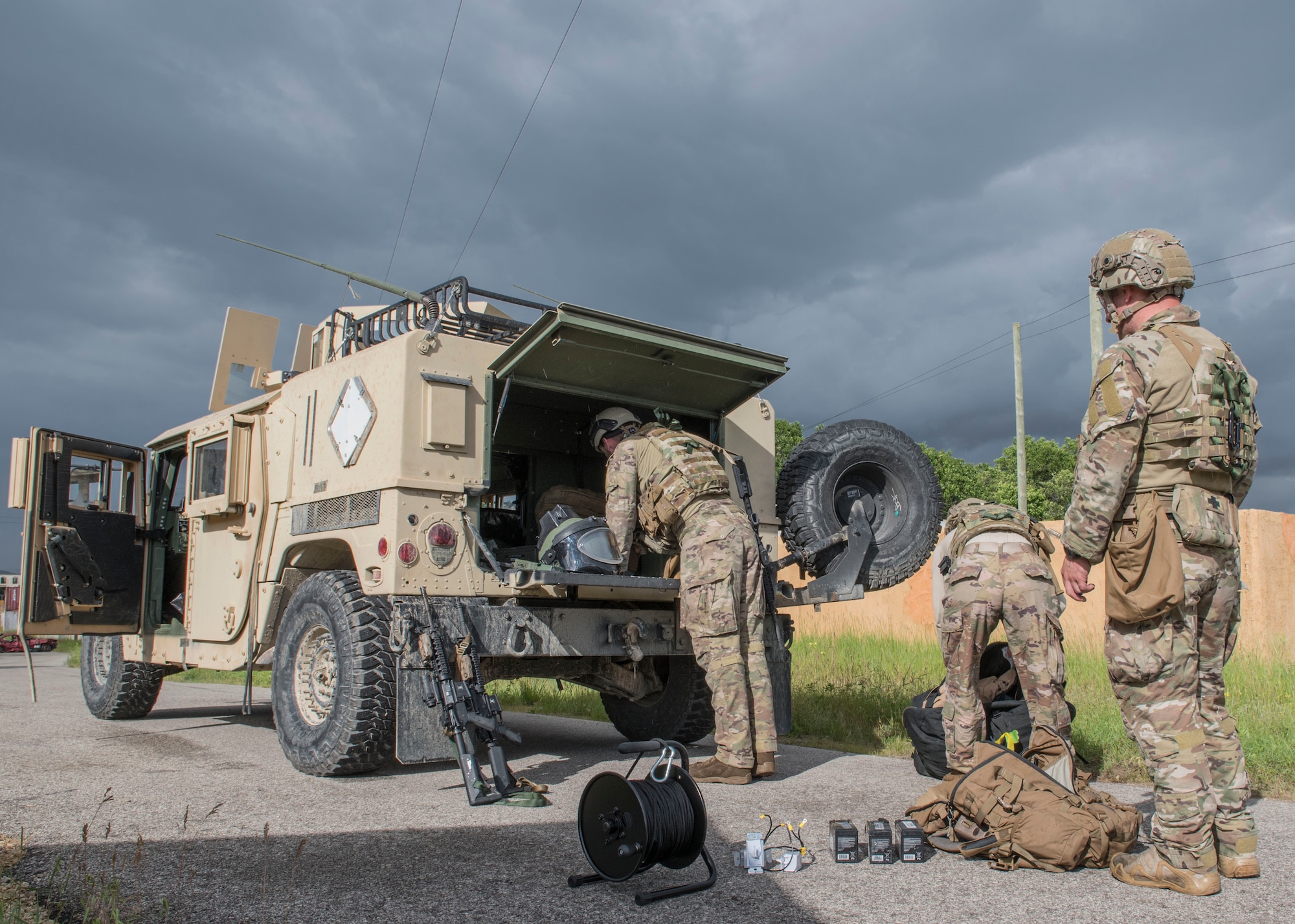 Explosive Ordnance Disposal technicians assigned to the 115th Civil Engineer Squadron, Truax Field, Madison, Wisconsin operate from the safety of a Humvee during the Audacious Warrior training exercise June 24. 2019. Audacious Warrior brings Air National Guard EOD units throughout the country together annually for training at Volk Field Air National Guard Base and Fort McCoy. (U.S. Air National Guard photo by Airman 1st Class Cameron Lewis)