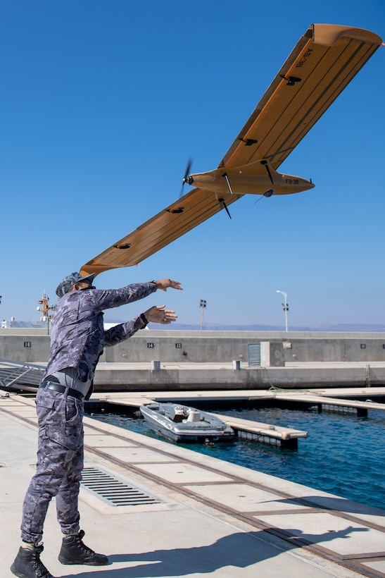 AQABA, Jordan (Feb. 14, 2022) Royal Jordanian Navy Senior Chief Malek Ta’ani hand-launches an M5D Airfox unmanned ariel system during International Maritime Exercise/Cutlass Express 2022 Feb. 14. IMX/Cutlass Express 2022 is the largest multinational training event in the Middle East, involving more than 60 nations and international organizations committed to enhancing partnerships and interoperability to strengthen maritime security and stability. (U.S. Navy photo by Mass Communication Specialist 2nd Class Dawson Roth)