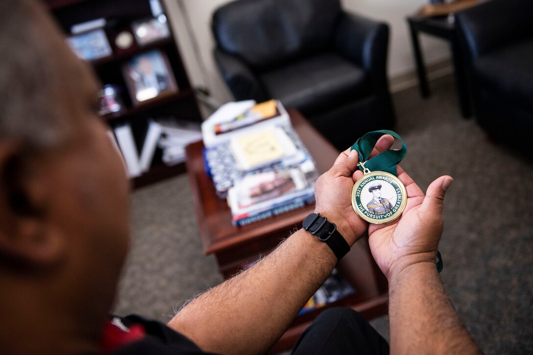 Man holds medallion