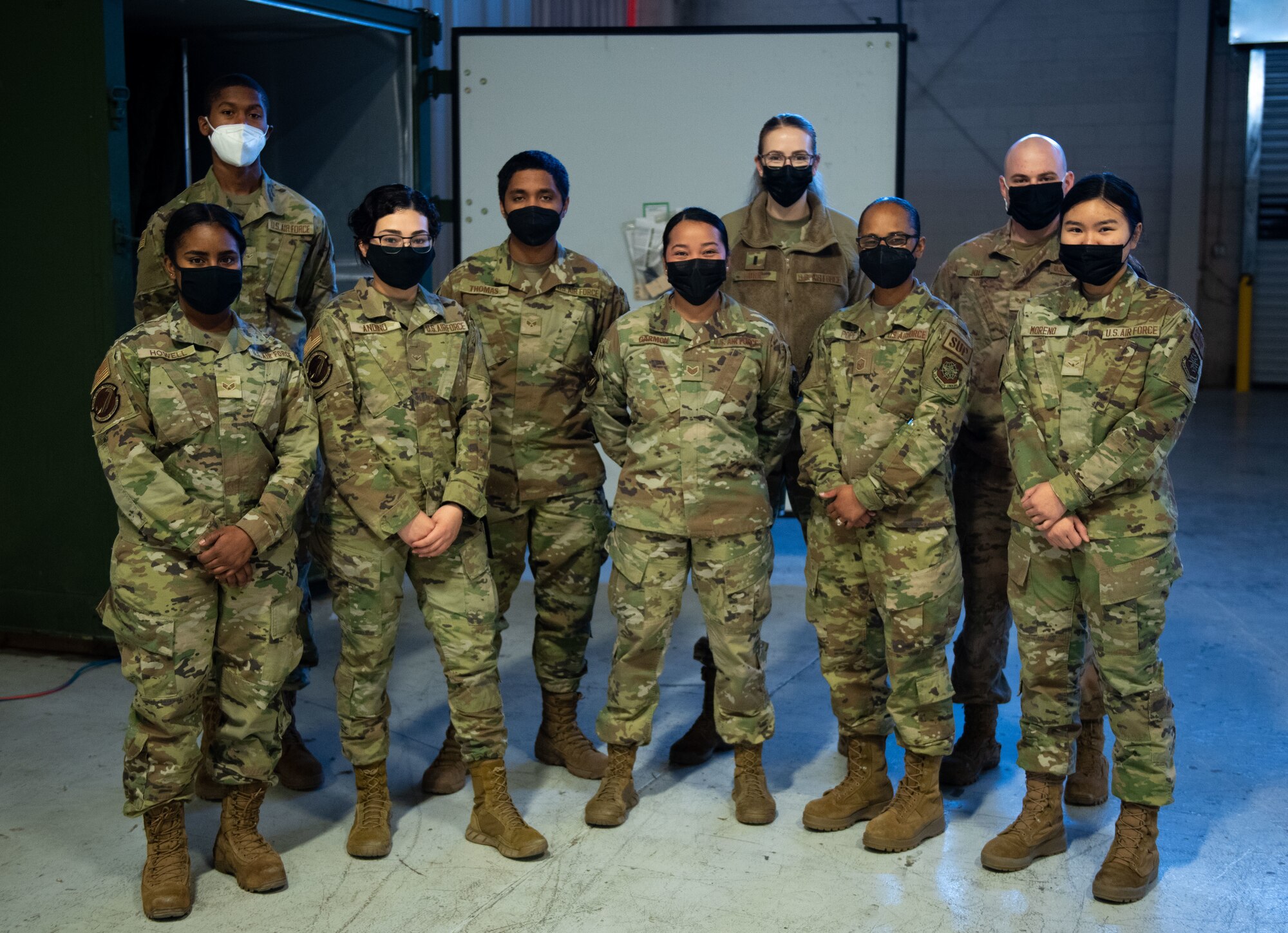 U.S. Air Force Airmen with the 87th Logistic Readiness Squadron material management flight pose for a photo at Joint Base McGuire-Dix-Lakehurst, N.J., Feb. 10, 2022. The material management flight is testing an innovative, lightweight sanitization method for deployment gear. (U.S. Air Force photo by Airman 1st Class Sergio Avalos)