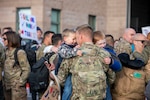 U.S. Army Soldiers assigned to Task Force Avalanche of the 86th Infantry Brigade Combat Team (Mountain), Vermont National Guard, return home from deployment, in South Burlington, Vermont, Dec 9, 2021. Family, friends, and colleagues were present to greet the Soldiers as they arrived. (U.S. Army National Guard photo by Sgt. Denis Nuñez)