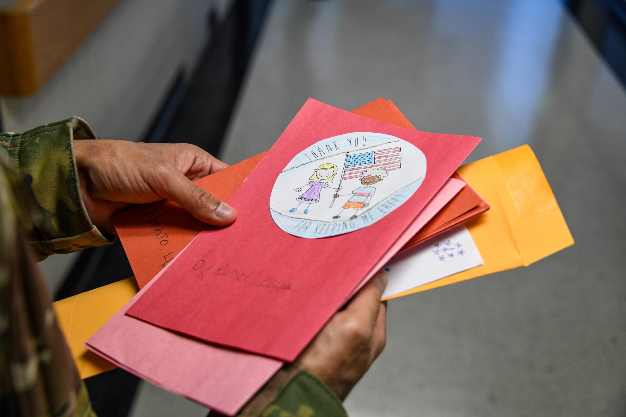 U.S. Air Force Airman 1st Class Gabriel Cruz-Lubina, 97th Communications Squadron systems technician, holds Valentine’s Day cards at the Clinton Veterans Center, Oklahoma, Feb. 14, 2022. More than 200 Valentine’s Day cards were made by students for local veterans. (U.S. Air Force photo by Senior Airman Kayla Christenson)
