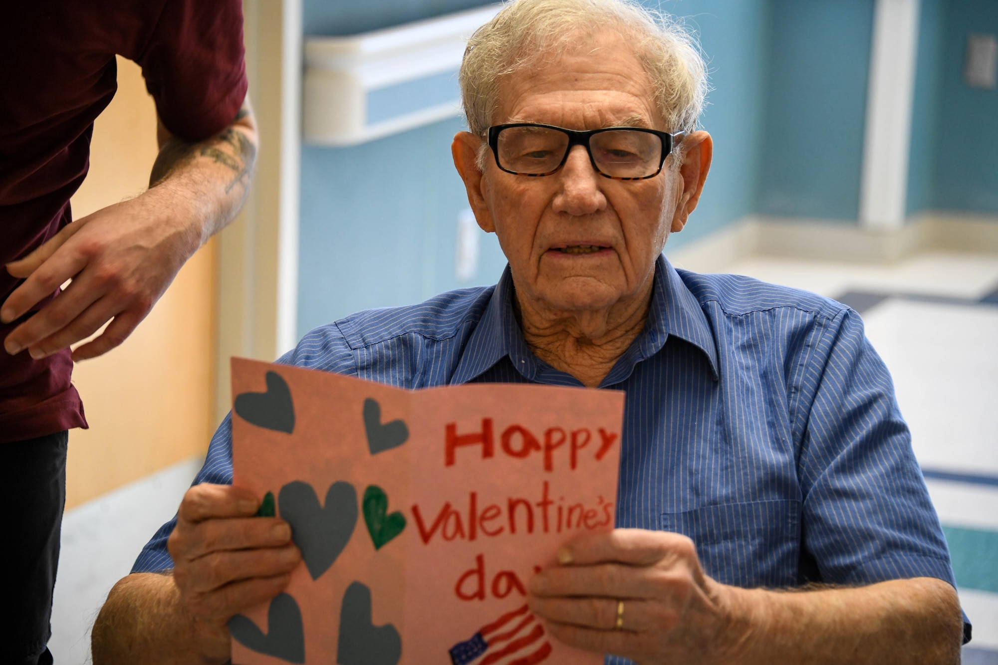 A veteran reads a Valentine’s Day card at the Clinton Veterans Center, Oklahoma, Feb. 14, 2022. Most veterans at this facility served during the Vietnam War, with one 97-year-old resident having served in World War II. (U.S. Air Force photo by Senior Airman Kayla Christenson)