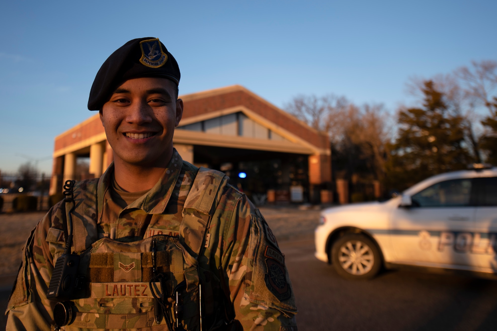 a picture of a Security Forces airman in front of a patrol car, linking to the Units page