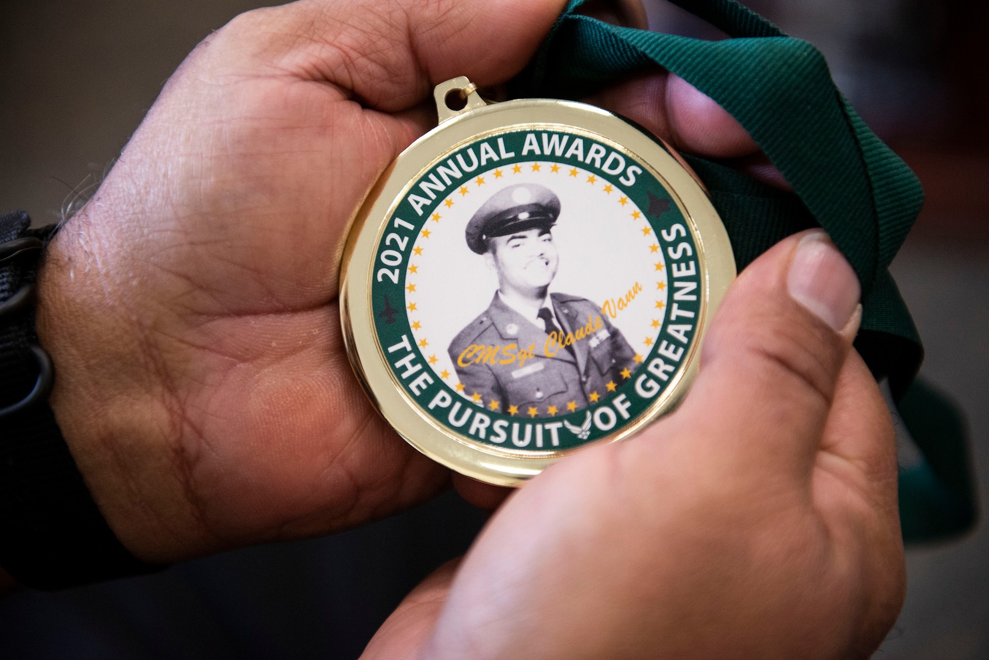 Man holds medallion