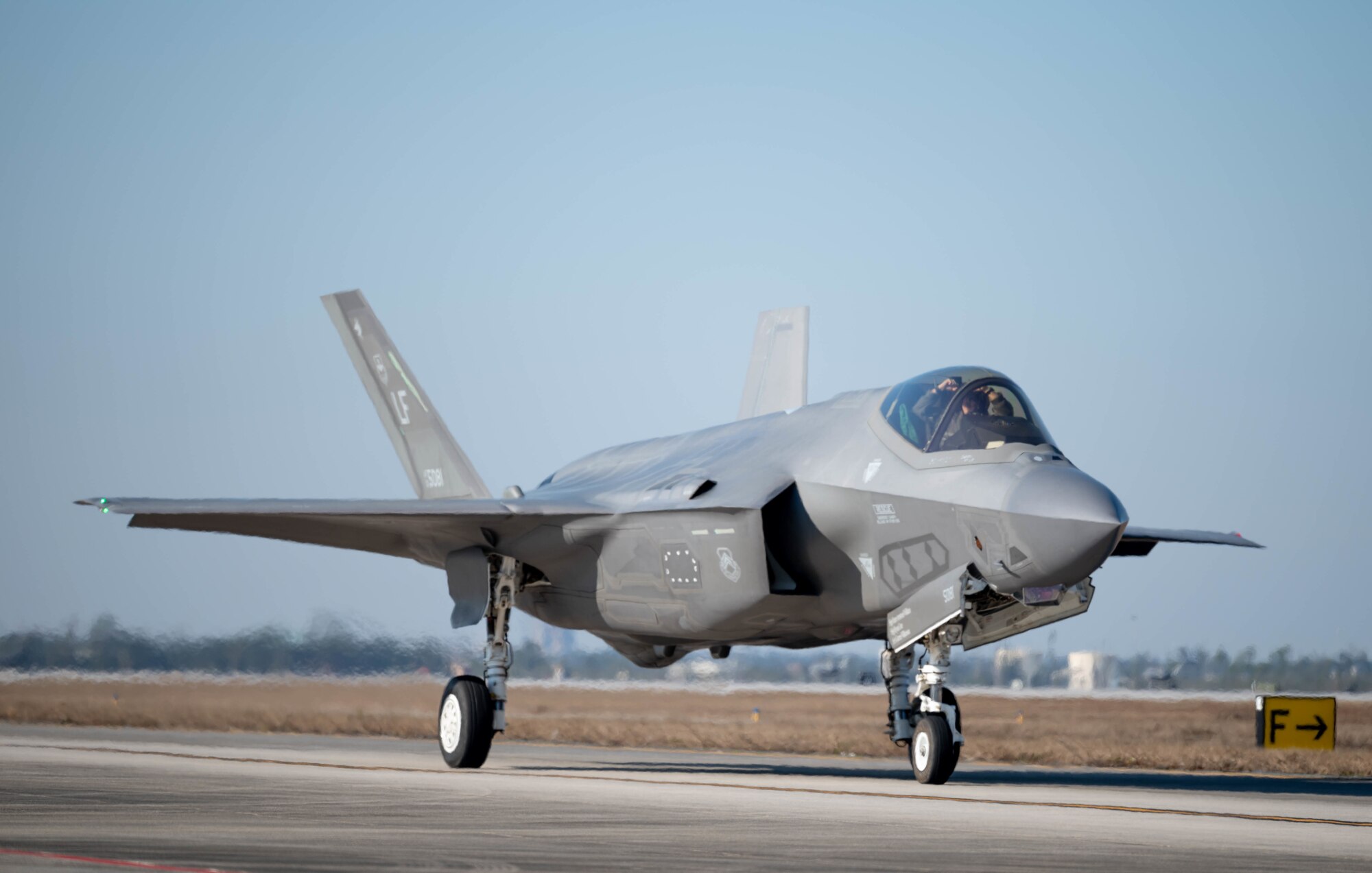 An F-35A Lightning II taxis on the flight line.