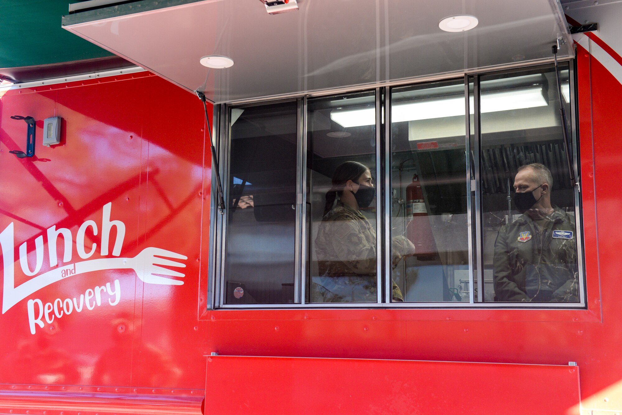 Airmen inside of food truck